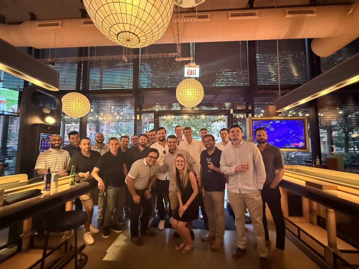 Full Waylin Partners team group photo at a bar during the Tampa offsite